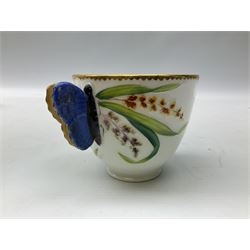 19th century teacup and saucer, possibly H R Daniel, together with a further teacup and saucer in the manner of Minton with butterfly handle, (2)