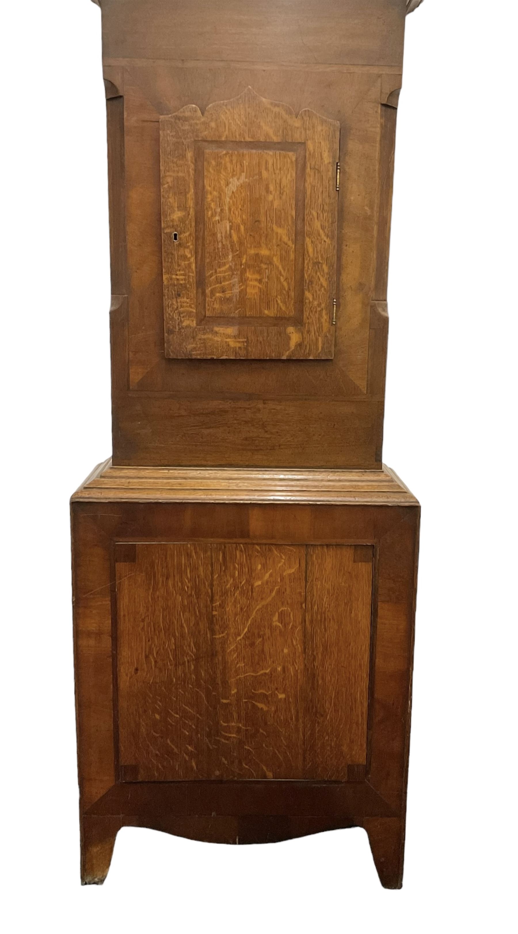 Richardson of Selby - late 19th century oak and mahogany longcase clock c 1860, with a swan necked pediment and brass paterie, break arch hood door flanked by ring turned pilasters,  oak trunk with crossbanding and a small inlaid trunk door, tall plinth with panel inlay with a shaped base,
painted dial with depictions of matching farm animals to the spandrels and a dog and small child to the arch, with Roman numerals, minute track, stamped brass hands, calendar aperture and seconds dial, weight driven rack striking movement, striking the hours on a bell. With weights and pendulum.