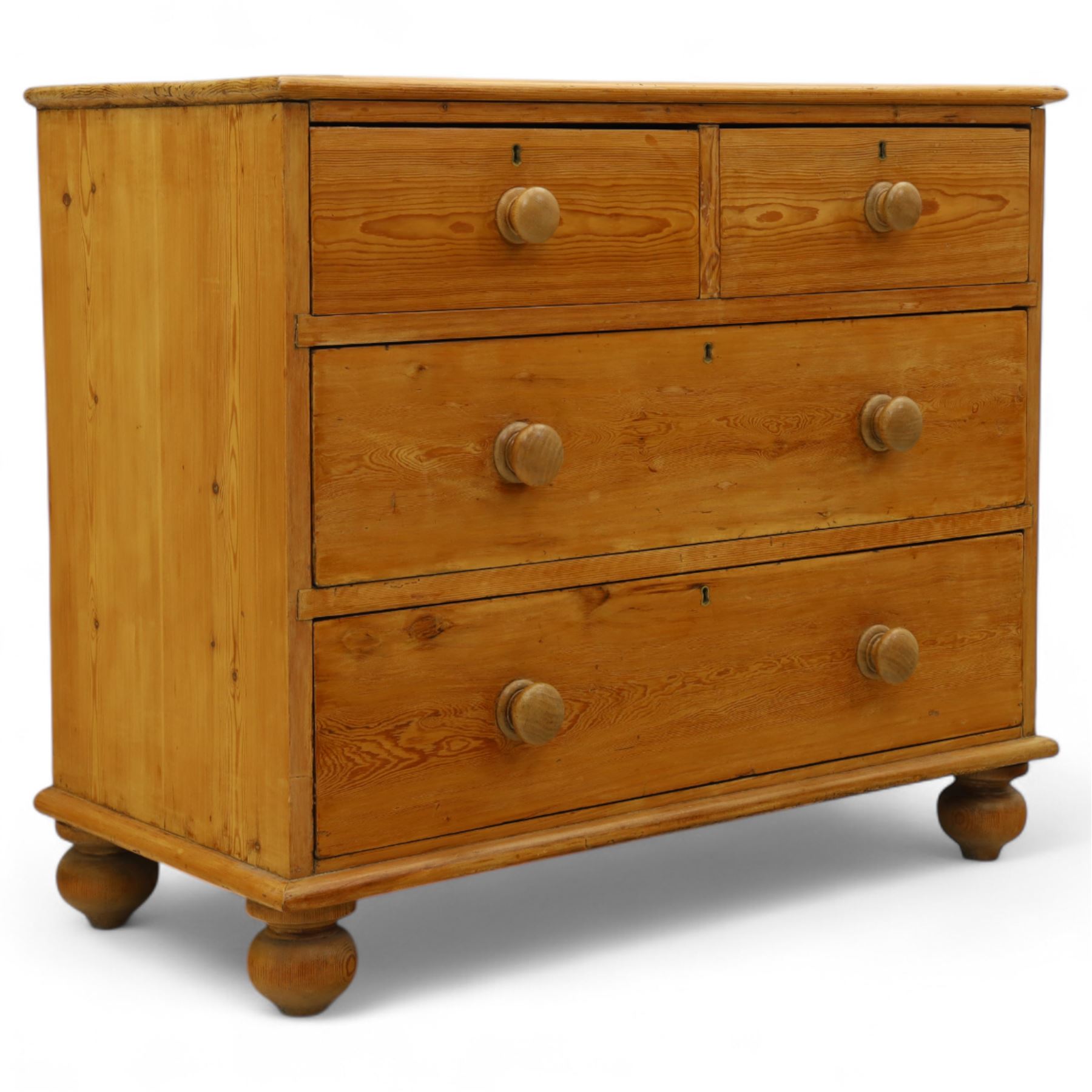Victorian stripped pine chest, rectangular top over two short and two long drawers with turned wooden knob handles, on bun feet