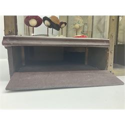 Early 20th century scratch-built wooden hat & gown shop diorama 'Joan', of double-fronted form glazed on three sides with brass and aluminium mounts, rear access apertures and storage under L63cm H45cm D31cm; with small collection of dresses and hats on display stands