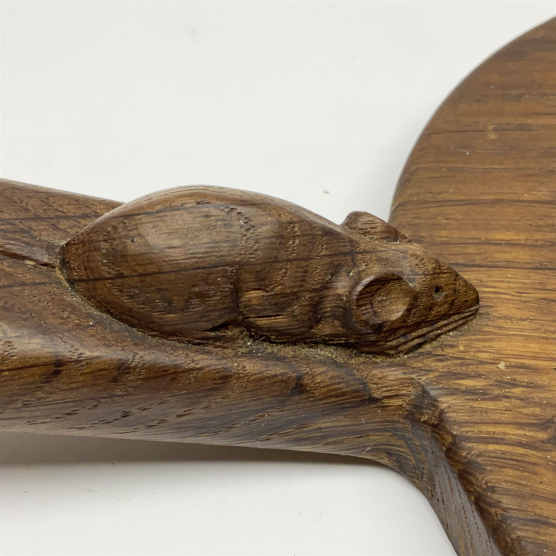 Mouseman - oak kidney-shaped cheeseboard, the handle caved with mouse signature, by the workshop of Robert Thompson, Kilburn 