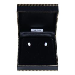 Pair of 9ct gold oval opal stud earrings, boxed
