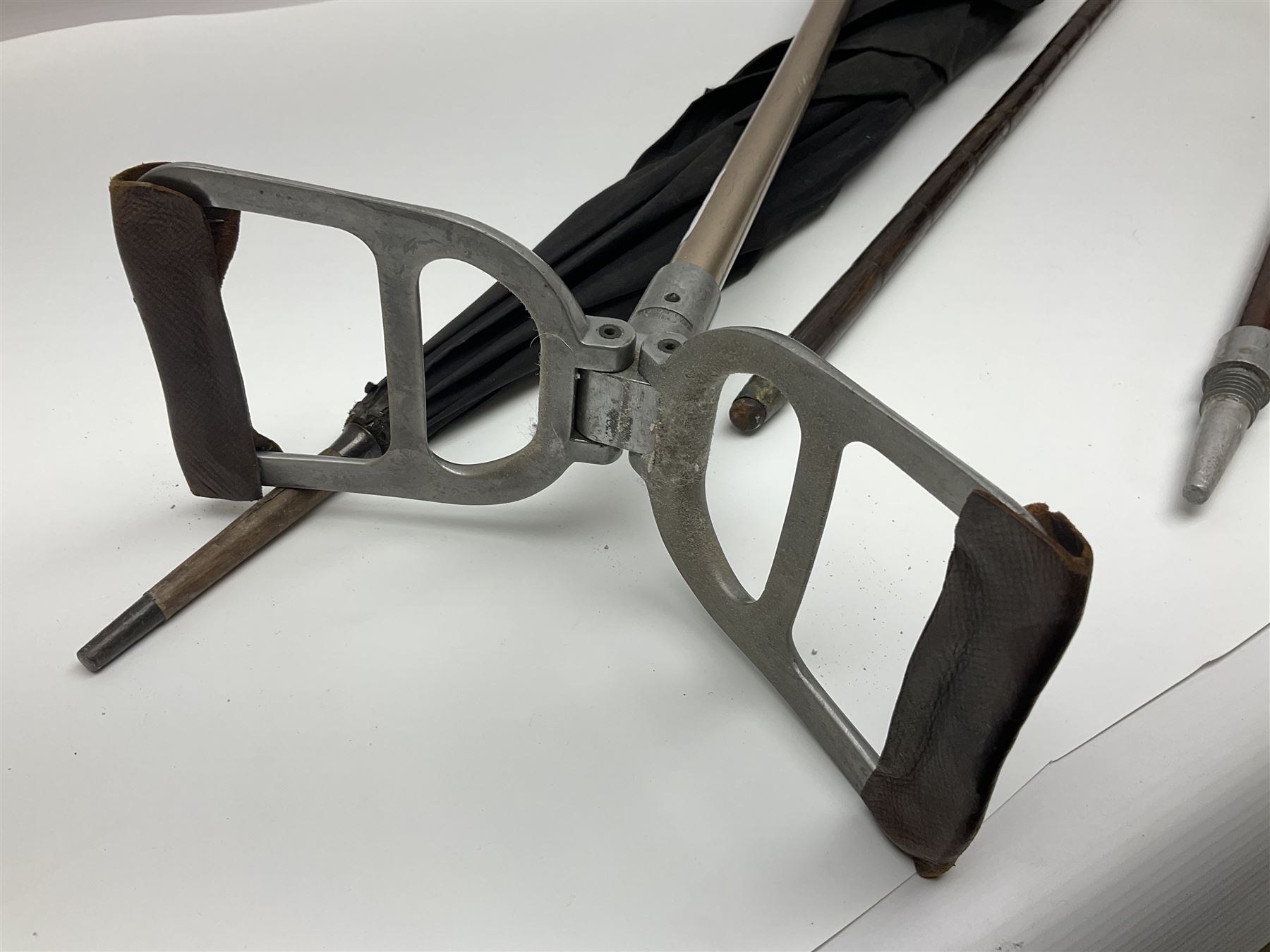 Early 20th century curved horn handle walking stick with hallmarked silver mounts, engraved L Russell 1918, together with a shooting stick by William Mills Birmingham, with leather handle, 'The Featherwaite' shooting stick and an umbrella with wooden handle