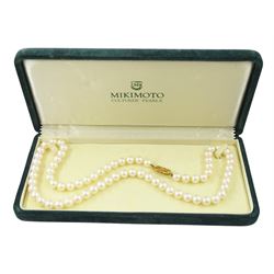 Mikimoto single strand cultured white pearl necklace, with 18ct gold clasp, stamped 750, boxed with certificate dated 1983