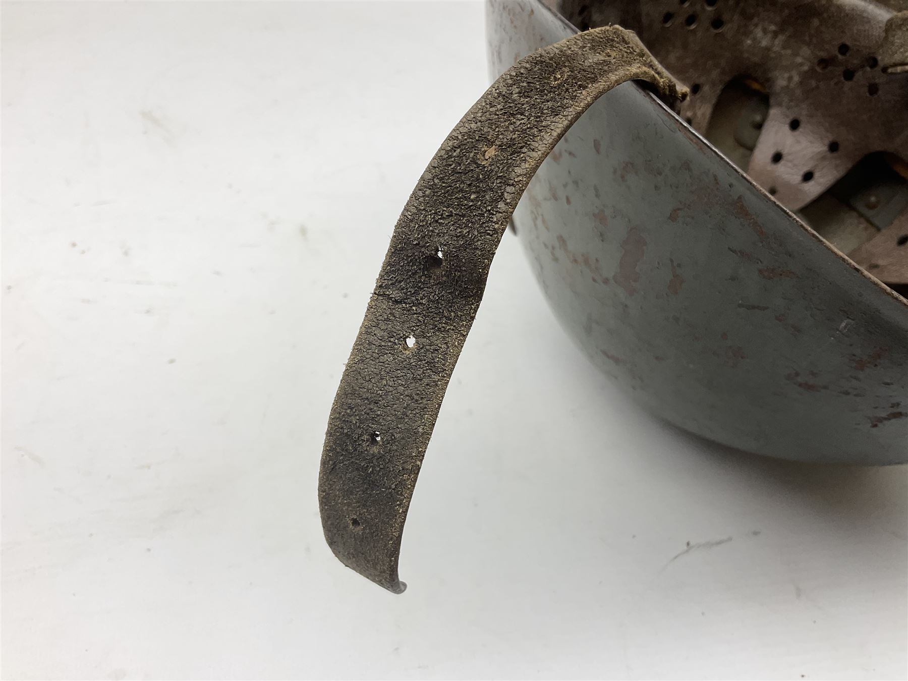 WWII Italian steel helmet with liner and chin strap