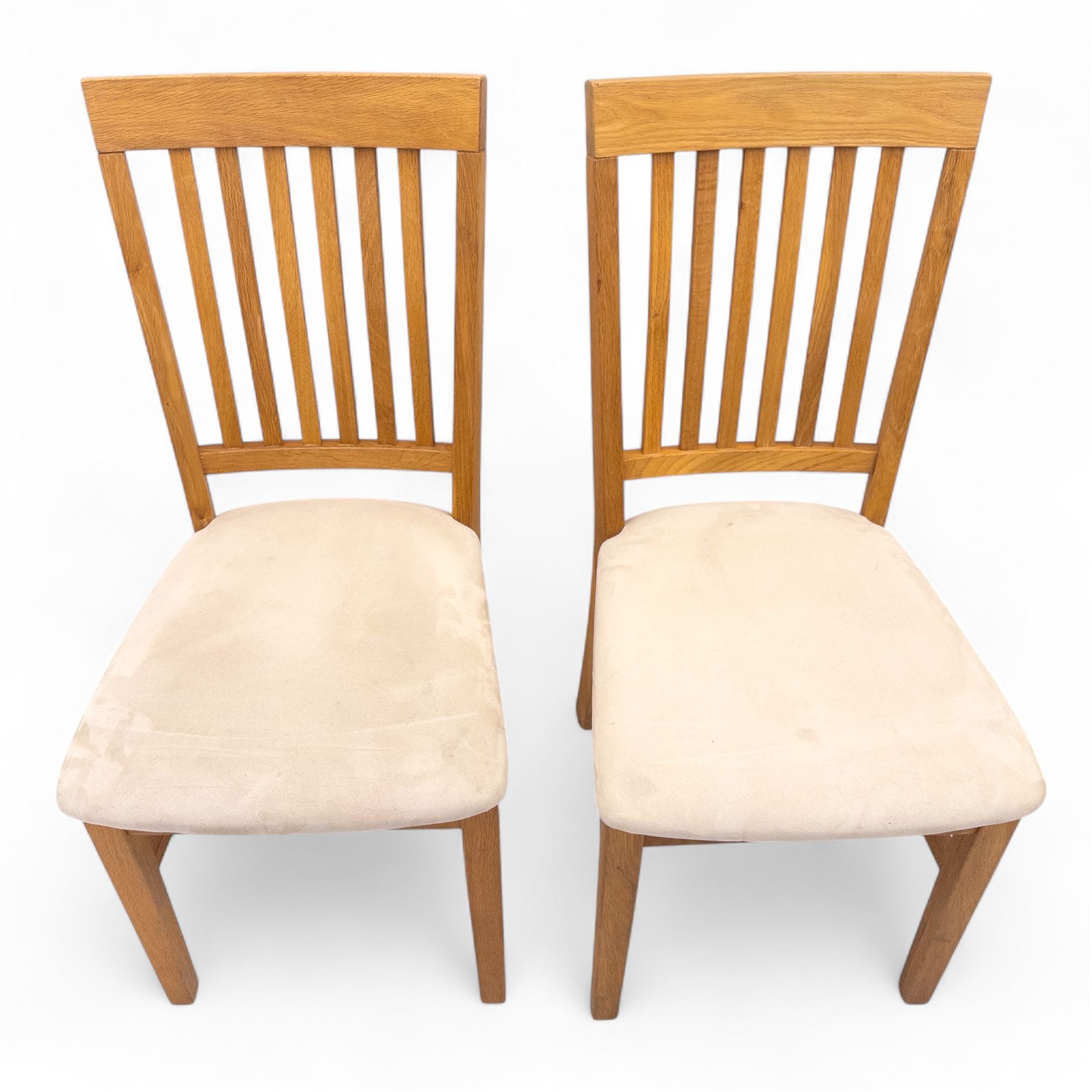 Contemporary solid oak rectangular dining table, with two additional extension leaves, together with eight matching high back dining chairs upholstered in cream suede-effect fabric (9) (Chair H 95cm, W 41cm, D 53cm) (Extends to 270cm)