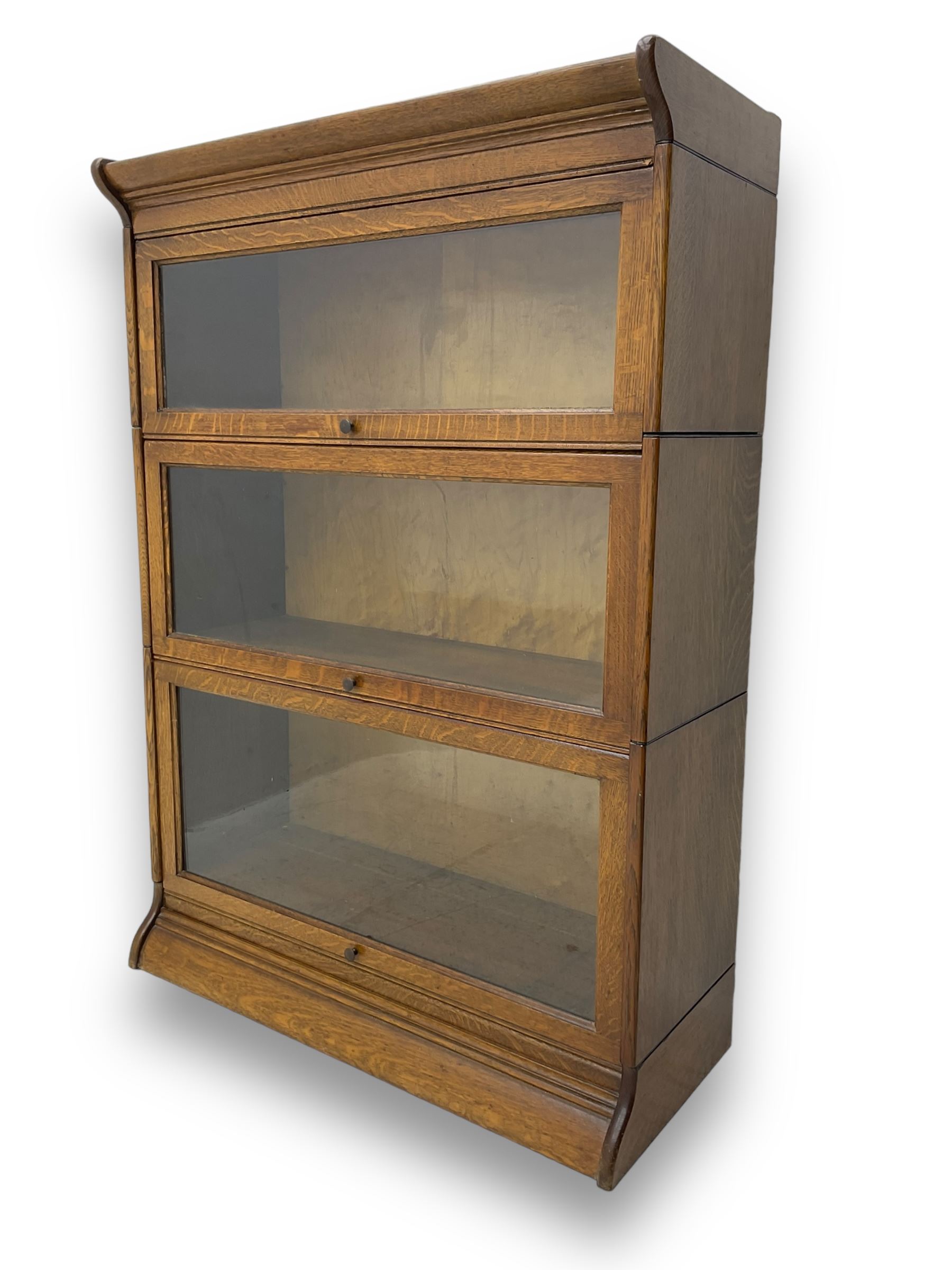 Early 20th century oak three-tier stacking library bookcase, enclosed by hinged and sliding glazed doors