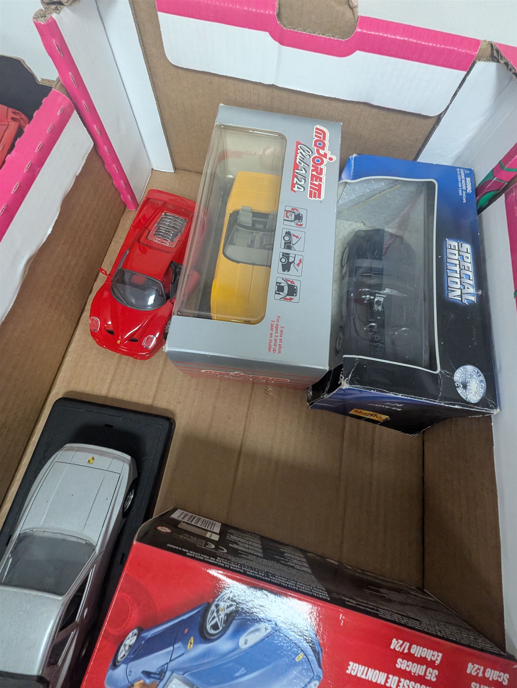 Diecast model vehicles, including Maisto, Majorette and Bburago examples, three boxed the rest loose, different scales, in three boxes