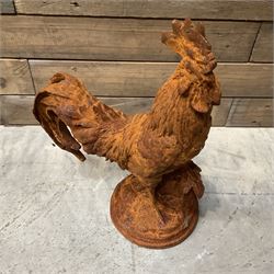 Small cast iron cockerell, on circular base