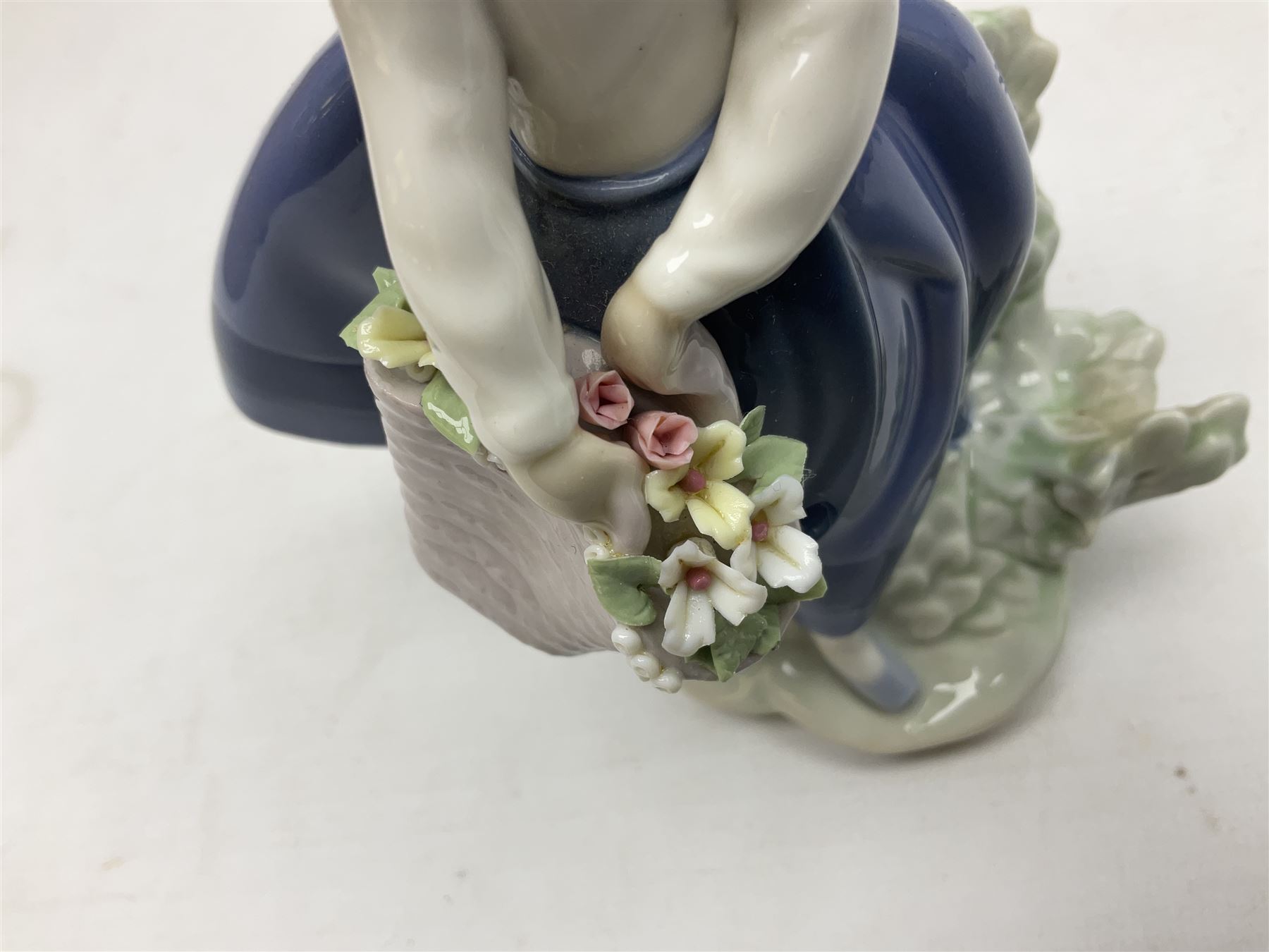 Three Lladro Flower Girls figures, comprising Sweet Scent no 5221, Pretty Pickings no 5222 and Spring is Here no 5223, largest example H18cm 