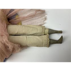 Victorian large wax over composition Pumpkin head doll, with inset dark glass eyes, moulded blonde hair in curls, stuffed body with carved and painted wooden limbs, grey painted boots, floral satin dress with netting underclothes H61cm