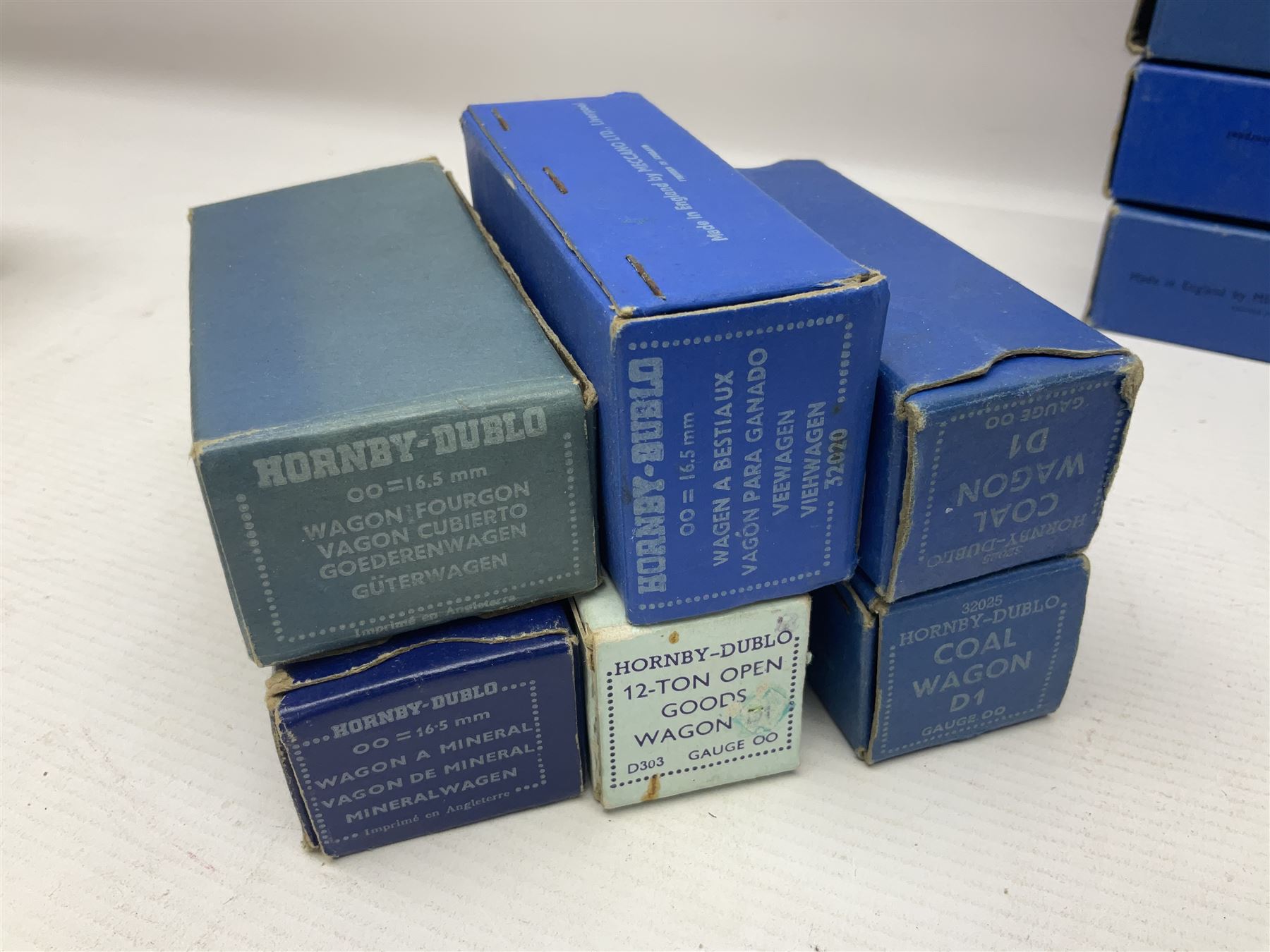 Hornby Dublo - nineteen goods wagons comprising 32040 Goods Van D1 (SR) in LMS stickered box, DR375 Goods Van D1 (GW), D303 Open Goods Wagon D1 (GW), 32044, 32076, 32052, 32021, 32074, 32056, 32065, DR379, 32070, 32020, DR373, two x 32075, High Sided Wagon D2 (LMS) in NE stickered box; all boxed; Tank Wagon D1 (Esso) and DR380 Meat Van D1; both in later unassociated boxes (19)