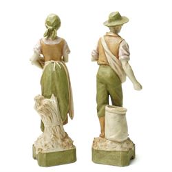 Pair of Royal Dux figures of agricultural workers modelled by Alois Hampel, one holding a scythe, the other sewing wheat model numbers 1457 and 1458 H32cm 