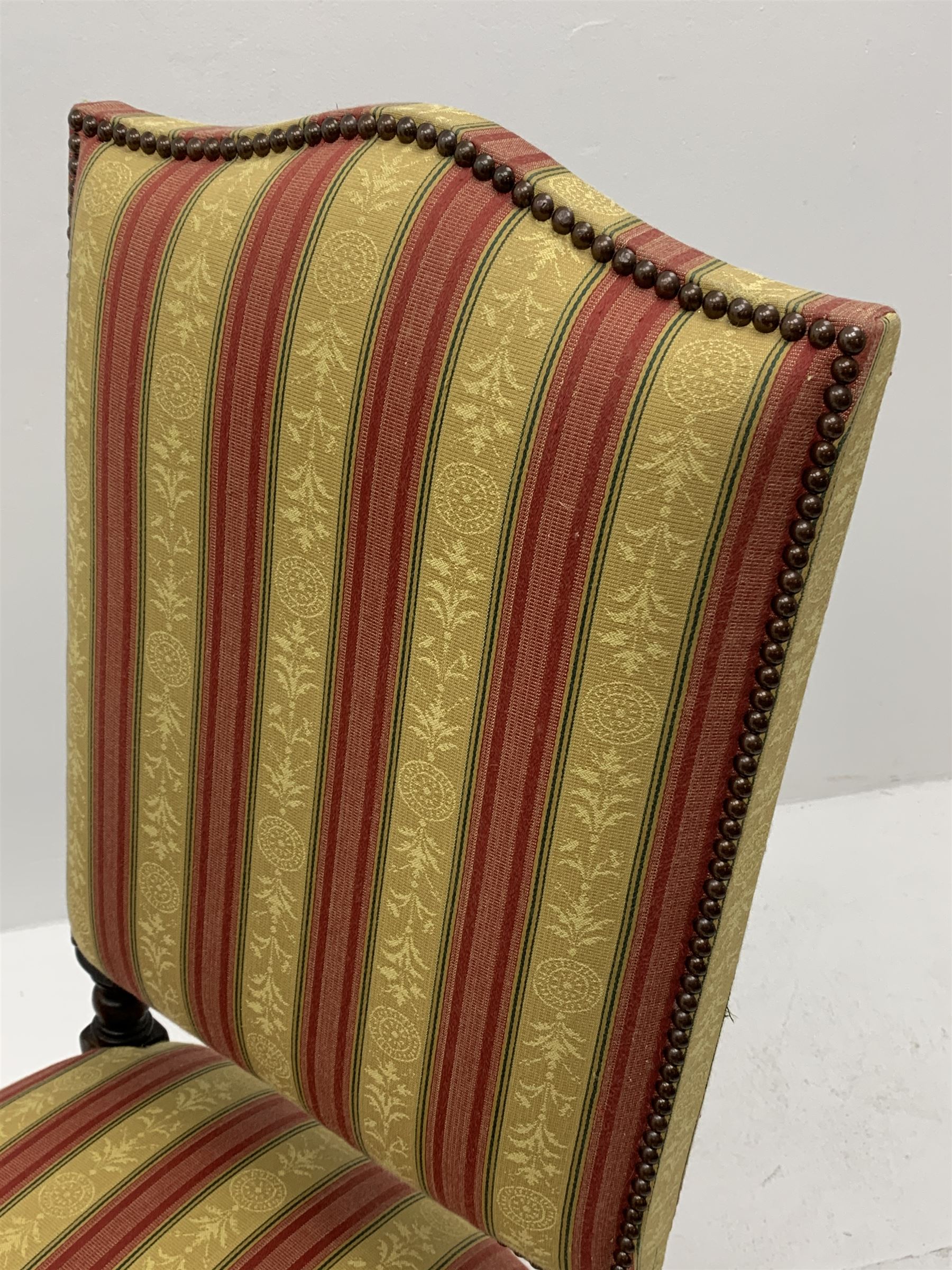 Royal Oak Furniture Co - Jacobean style oak dining table, rectangular top with a lunette carved frieze, acanthus carved baluster cup and cover supports joined by angular stretchers (276cm x 122cm, H81cm), and set ten (8+2) oak framed high back dining chairs upholstered in striped fabric with studded detail, turned supports and stretchers