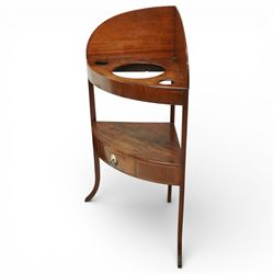 George III mahogany corner washstand, the shaped splash back above a quarter circular top with central basin aperture and flanking soap holes, undertier shelf, single bowed drawer with brass ring handle, raised on slender square and cabriole supports