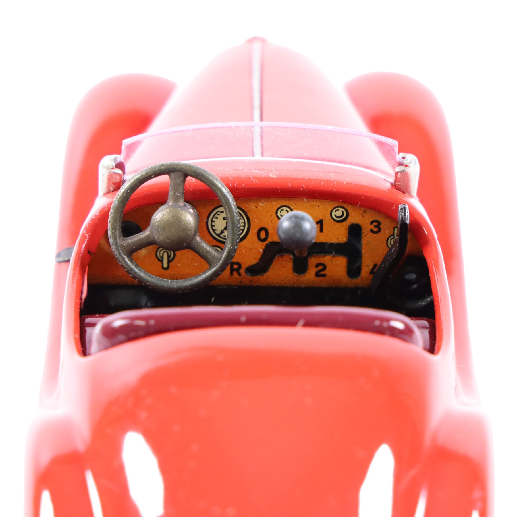 Schuco Examico 4001 tinplate clockwork car, in red with burgundy interior, with key and instructions, boxed