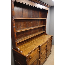  19th century oak dresser, raised three tier plate rack with turned half column uprights, six drawers and two cupboards with geometric moulding, W167cm, H206cm, D51cm  
