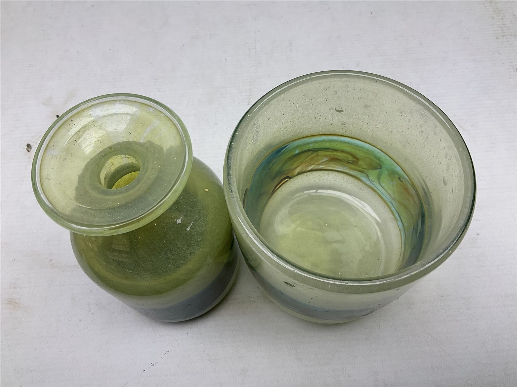 Mdina sea and sand glass vase, of cylindrical form, decorated in green, turquoise and brown, and matching vase, both unmarked together with a glass bowl and jug with gilt decoration 