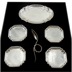 Danish silver dish by Michelsen dated 1899, Norwegian silver twist loop spoon by M. Sunde and four Egyptian silver coasters, all stamped or tested, approx 8.5oz 