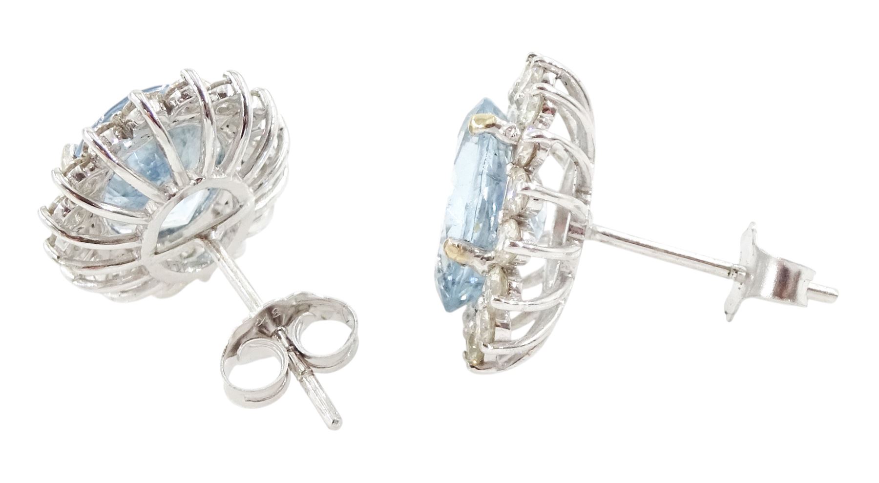Pair of 18ct white gold oval cut aquamarine and round brilliant cut diamond cluster stud earrings, total aquamarine weight 5.00 carat, total diamond weight approx 1.05 carat