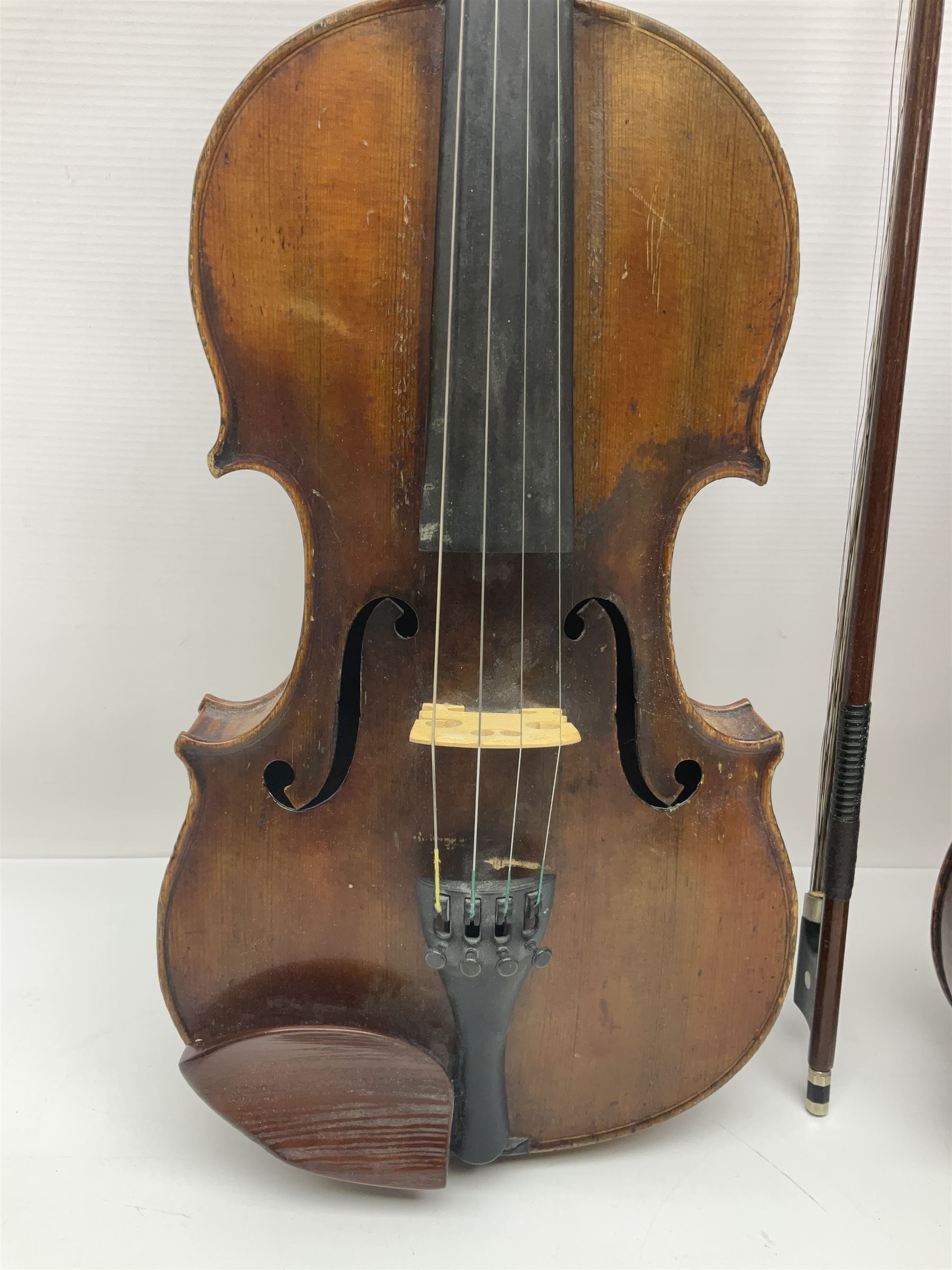 German trade violin in the Steiner style c1900 with 35.5cm two-piece maple back and ribs and spruce top L59cm overall; in fitted carrying case with two bows; and a Saxony violin with 35.5cm one-piece maple back and ribs and spruce top L58.5cm overall (2)