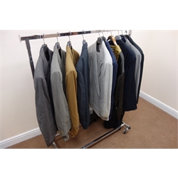  Giorgio Armani blazer, Pal Zileri trouser suit, Holland & Sherry blazer, Nino Danieli two trouser suits and blazer and other suits, Egeria robe, with suit covers and two chrome clothes rail on castors, one a/f    