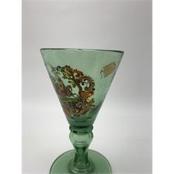 19th century bohemian green glass wine glass, the funnel bowl decorated in enamells with a Historismus hunting scene in the manner of Egermann & Lobmeyr, upon a baluster stem and circular foot, H14.5cm