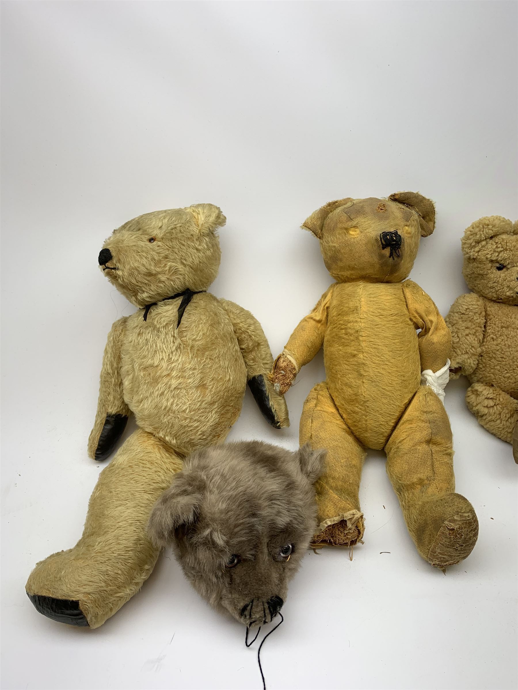 Quantity of early wood wool filled teddy bears for restoration.