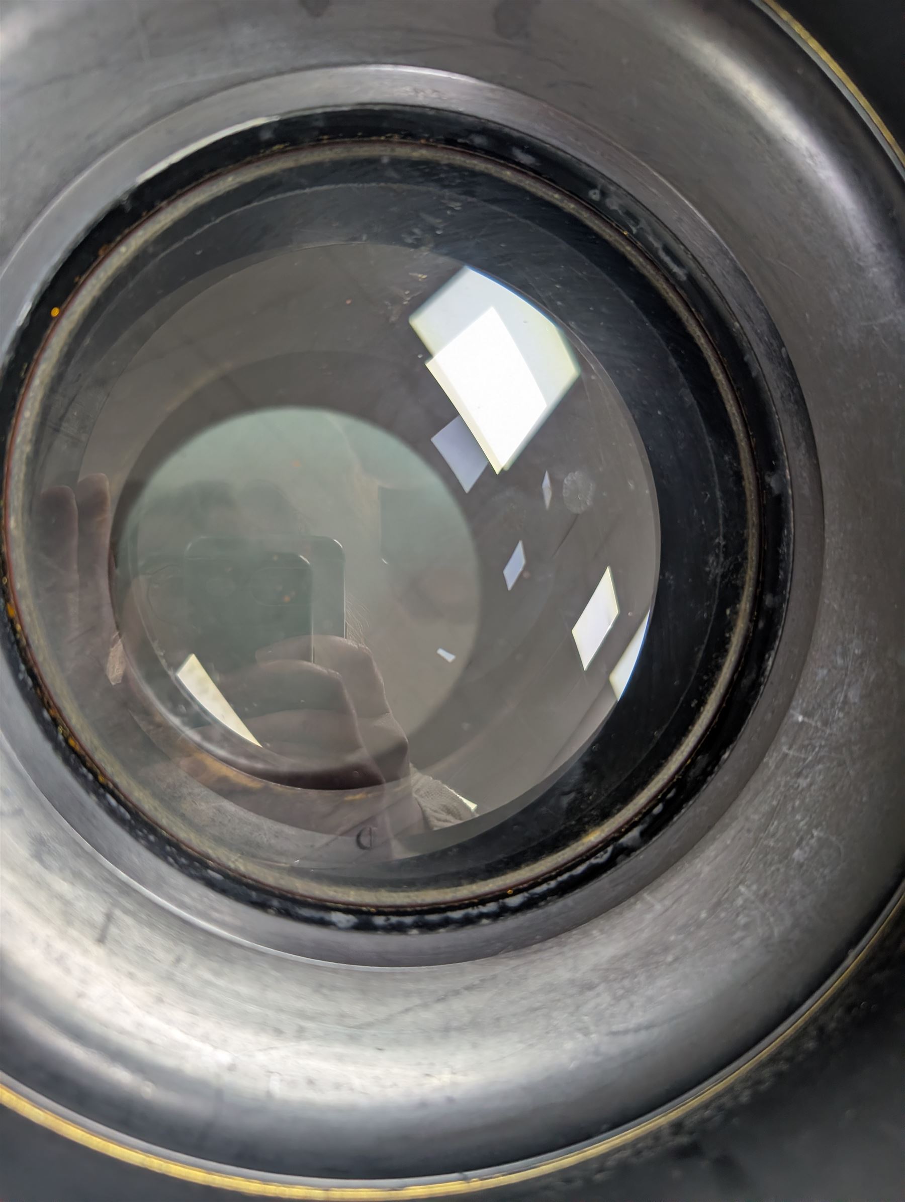 Late 19th century Voigtlander & Sohn large brass Euryscop lens no. 8 serial no. 31590, mounted to long black wooden box, with leather lens cover and seven brass Waterhouse stops, lens case D19cm