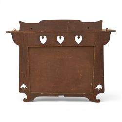 Arts and Crafts oak wall mirror, rectangular mirror plate within shaped frame, raised shelf with shaped back and pierced heart detail, bracket supports and shaped lower rail