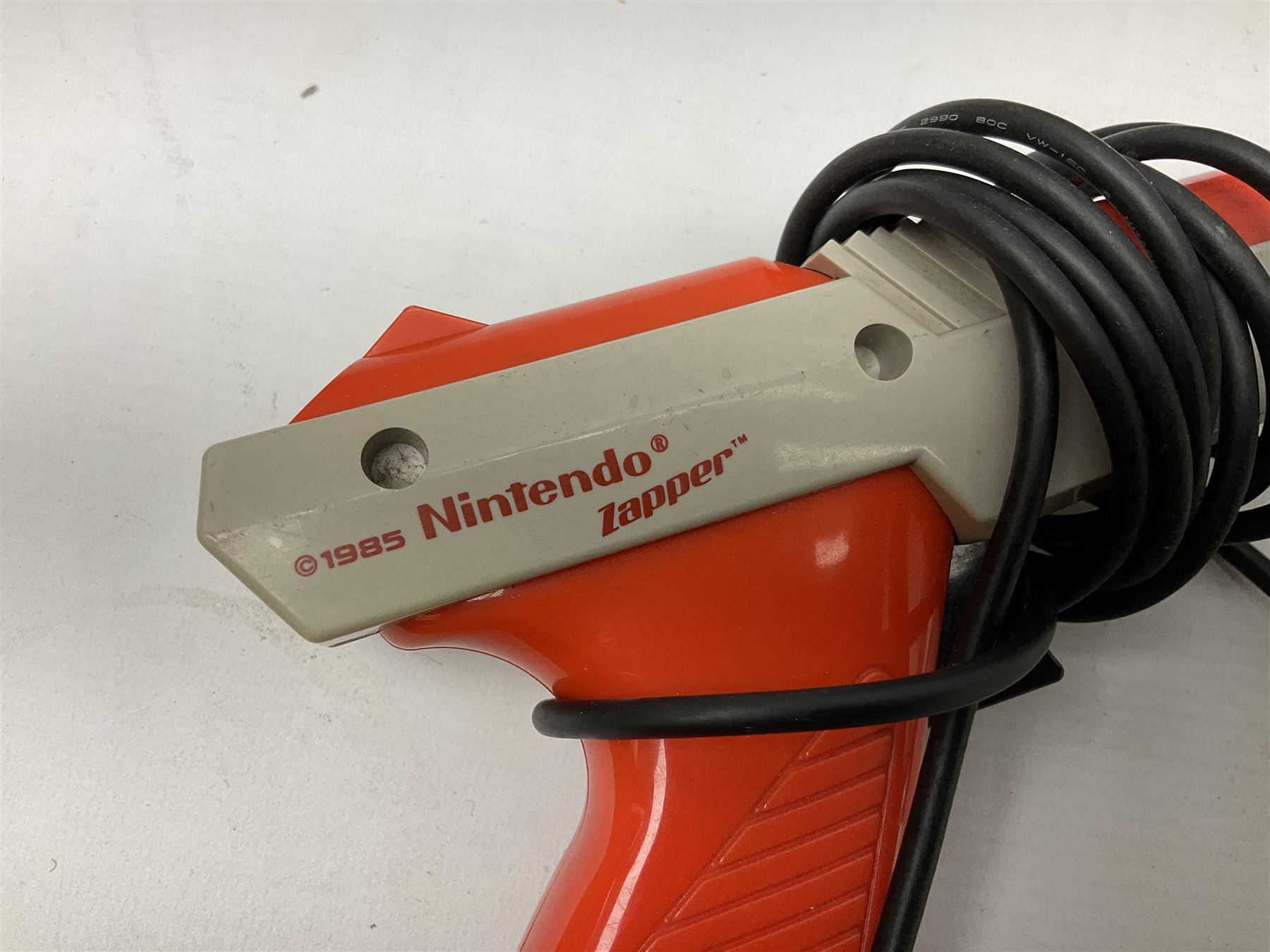 Nintendo Entertainment System (1985) console with two controllers, accessories and instruction booklet. NES Games ‘Duck Hunt’ with Nintendo Zapper gun, ‘Pinball’ and ‘Super Mario Bros.’, all with original sleeves and instruction booklets. NES game ‘Super Mario Bros. 2’ cartridge only