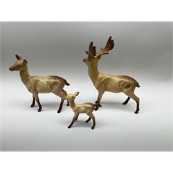 A Beswick family group, comprising stag, doe, and fawn, largest H20.5cm