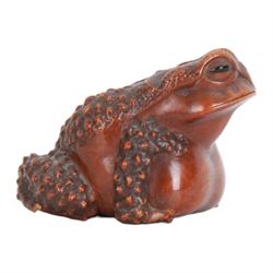Japanese Edo Meiji period carved wooden netsuke, naturalistically modelled in the form of a seated toad with textured skin and black horn inlaid eyes, signed beneath for Masanao, Yamada, Ise Province, H5cm L7.5cm, 