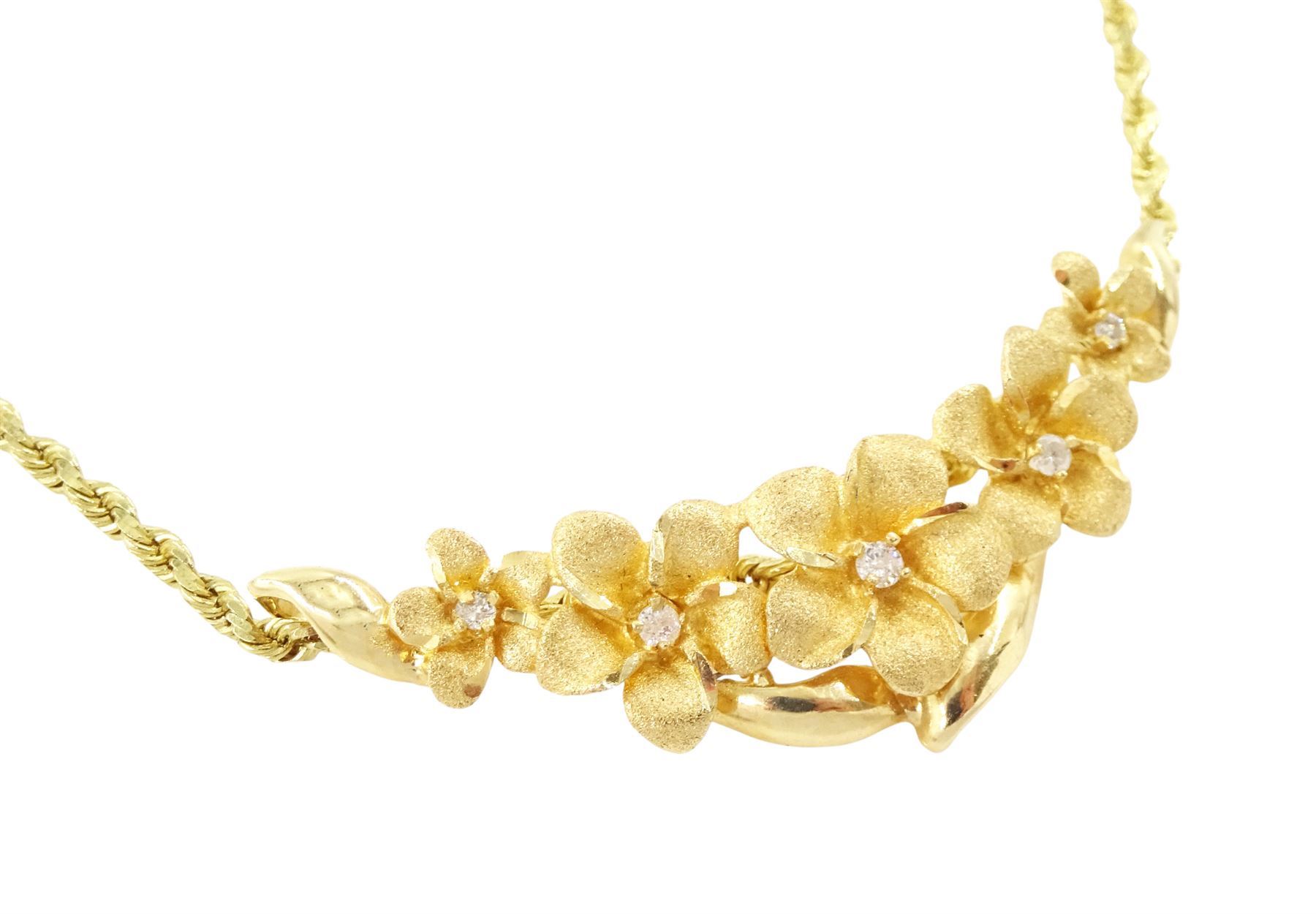 14ct gold diamond flower head necklace, five graduating flowers, each set with a single round brilliant cut diamond, on a rope twist chain necklace