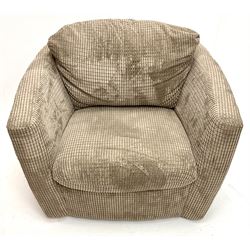 Swivel tub shaped armchair upholstered in jumbo cord fabric 
