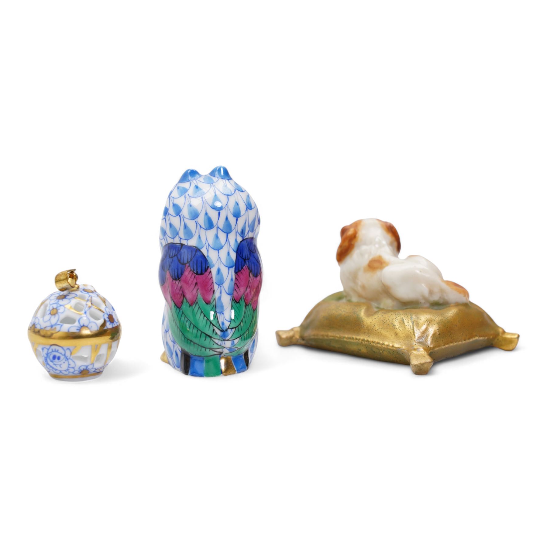 Herend miniature porcelain model of an owl and pierced pendant with 18k gold plate bale, together with an early 20th century Royal Worcester miniature porcelain model of a King Charles Spaniel seated on a cushion, L4.5cm (3)