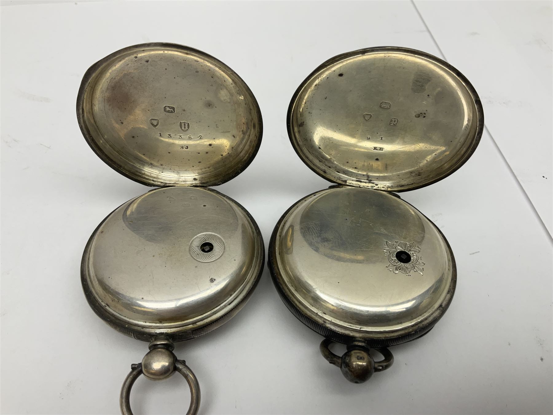 Three Victorian silver lever open face pocket watches including, cream dials with Roman numerals and subsidiary seconds dial, silver cylinder pocket watch and an 8 Jours Hebdomas pocket watch, two silver watch chains and one other chain