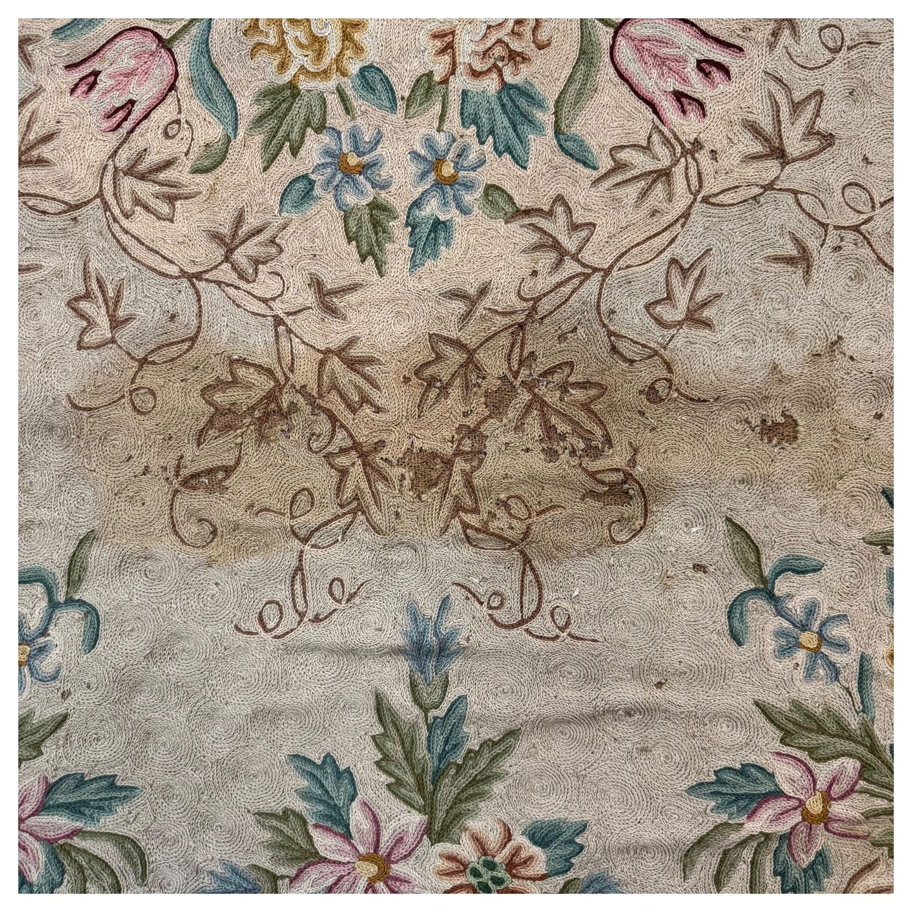Two early 20th century Kashmiri cyan ground crewelworks 