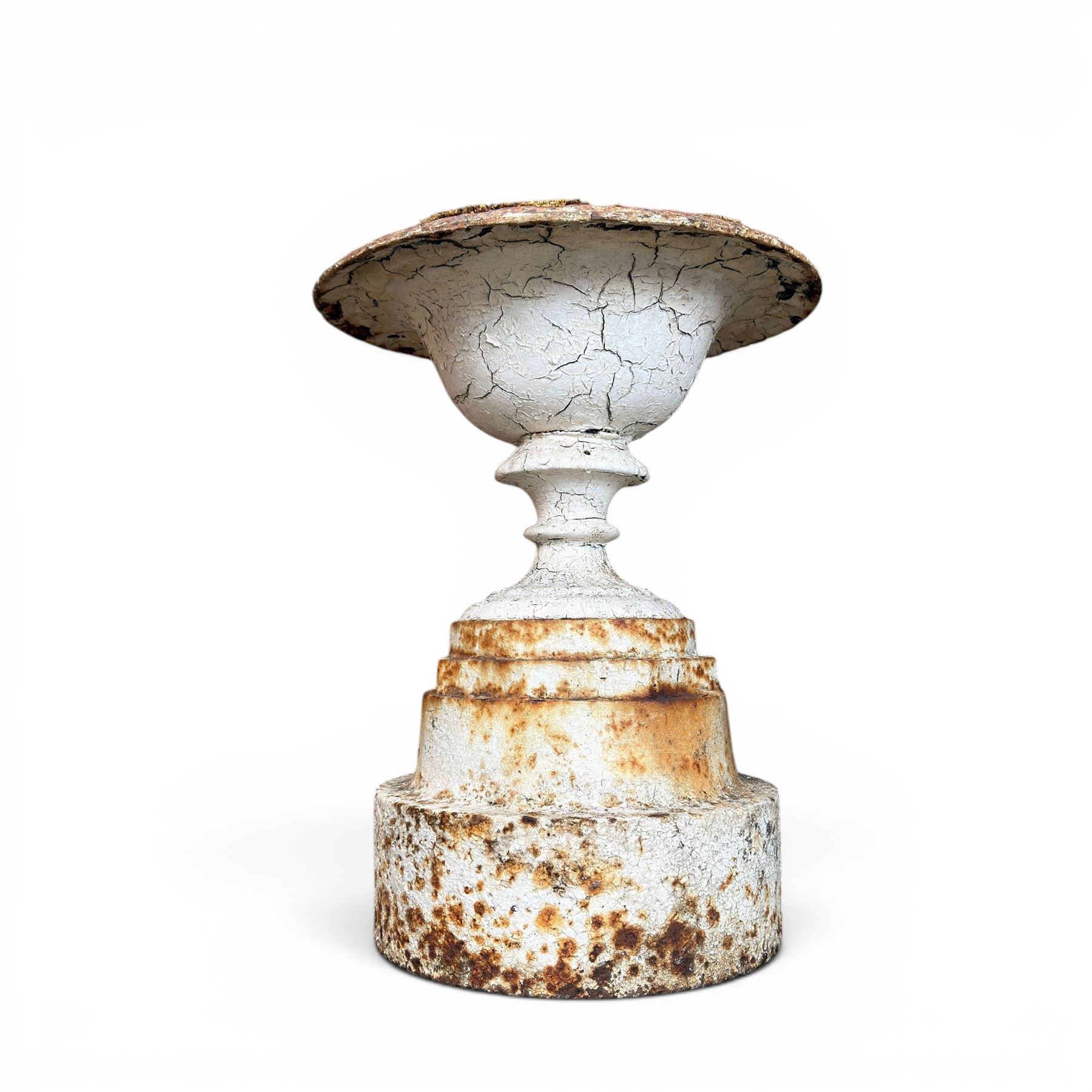 Victorian cast iron garden urn, egg and dart rim with shallow bowl, raised on stepped circular pedestal, finished in weathered white paint 