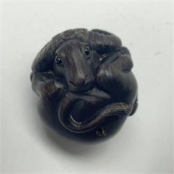 Two hardwood carved netsuke, the first example modelled as a water buffalo, the second a rat holding a bag of grain, H4cm