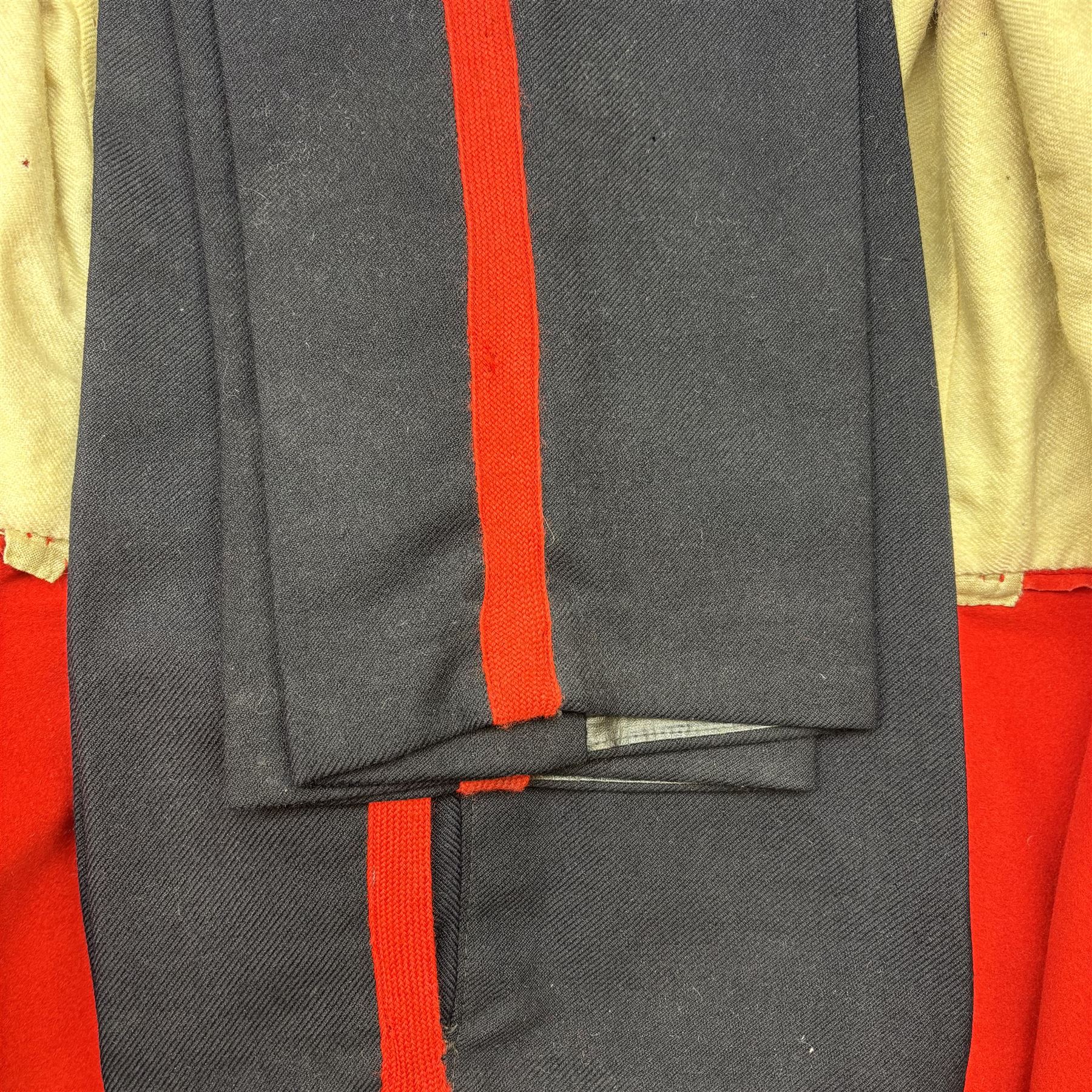 Prince of Wales Own Yorkshire dress tunic and trousers, with drummer badge to right sleeve, jacket H67cm