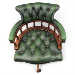 Captains swivel desk chair upholstered in buttoned green leather, five point star base raised on castors