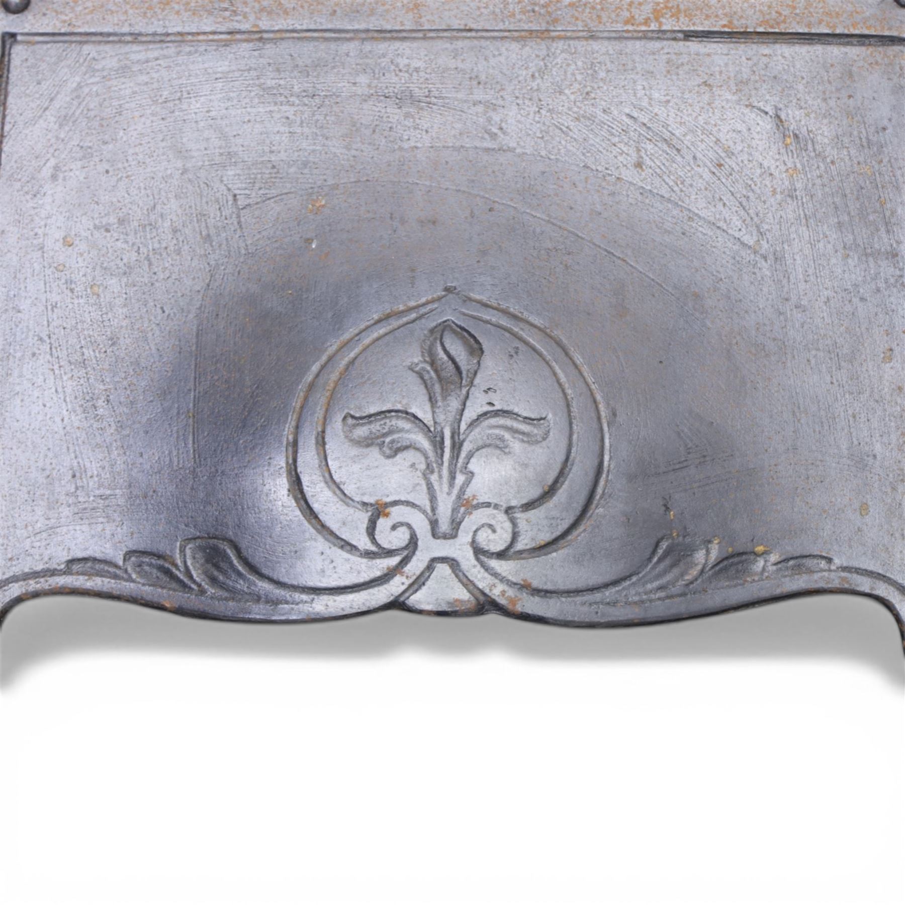 Art Nouveau cast iron fireplace, shaped hood with scrolling foliate crest, relief cast panel of female figure seated within shell form amidst wave motifs, uprights cast with foliate designs