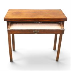 Georgian oak tea table, rectangular fold-over top above single frieze drawer with brass swing handle, shaped apron, gateleg raised on square tapering supports
