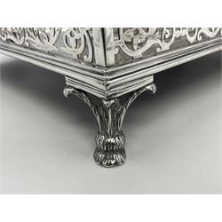 Edwardian silver desk stand, of rectangular form with scrolling pierced gallery, and pen recess before two silver mounted cut glass inkwells, upon four hoof feet, hallmarked Thomas Bradbury & Sons, London 1902, including inkwells H11cm W36cm D22cm