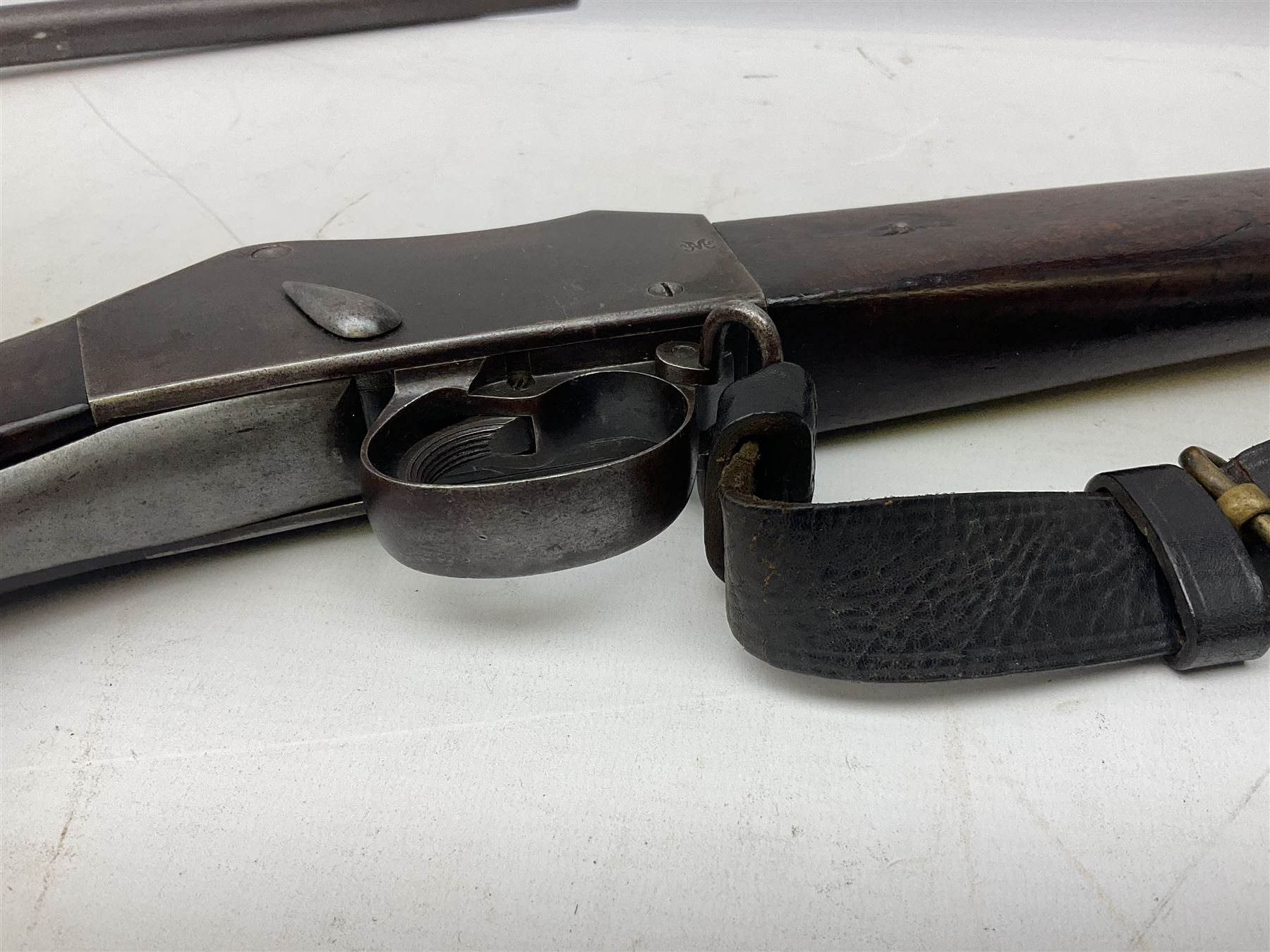 Braendlin Armoury Martini action .577/450 falling back rifle, the 85cm rifled barrel stamped Alex. Henry Edinburgh & London with two barrel bands including Yatagan bayonet side fitting and clearing rod under, with leather sling, serial no.13332, L126cm (NB. Firing pin broken). 