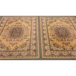  Two Persian style beige ground rug, central medallion, repeating border, 230cm x 160cm    