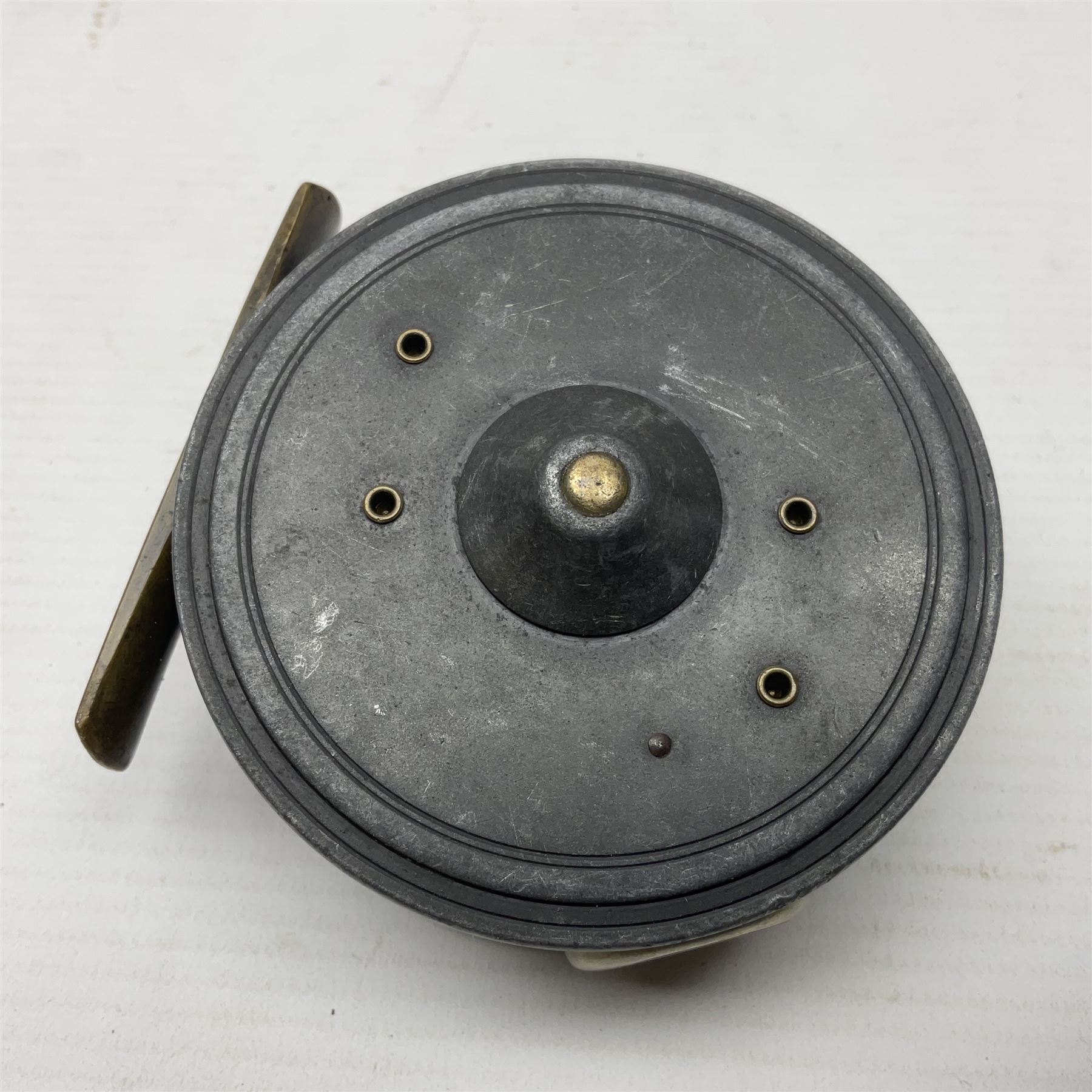 3 inch trout fly reel, with brass foot, original handle and telephone centre latch, unmarked but in the style of Hardy Uniqua 
