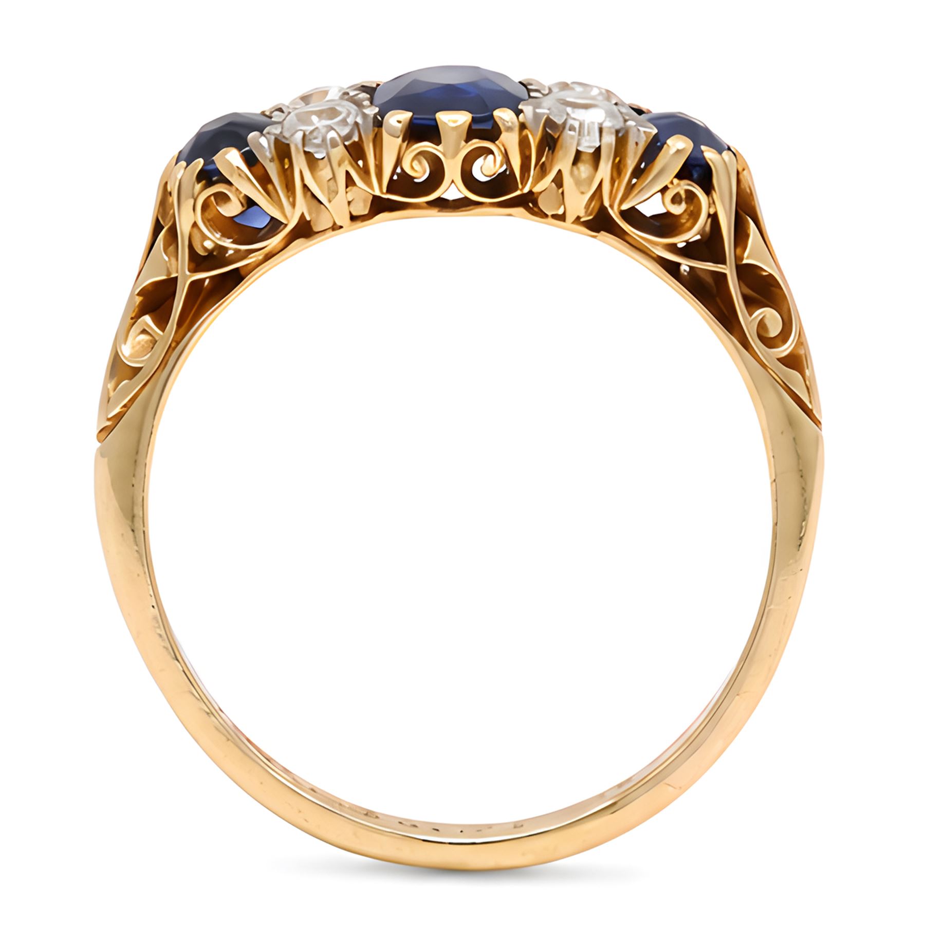 Early 20th century gold sapphire and diamond ring, three vari-cut sapphires, spaced by four old cut diamonds, with scroll design shoulders, stamped 18ct, total sapphire weight approx 1.45 carat, total diamond weight approx 0.30 carat