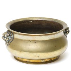 Chinese Ming dynasty gilt bronze censer, of circular bellied form with temple lion mask handles, upon a circular foot, six character Xuande mark to base, D15.5cm